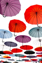 Fototapeta na wymiar multi-colored umbrellas on a white background