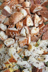 Small  pieces of Lithuanian rustic rough wheat white  bread  background