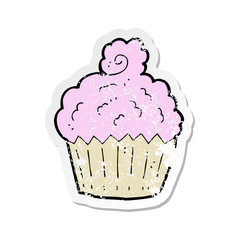 retro distressed sticker of a cartoon cupcake