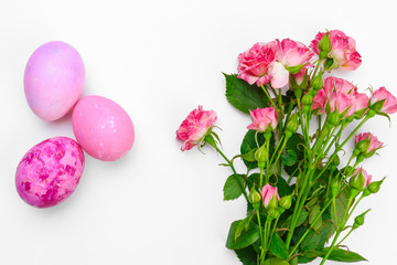 Easter eggs with tulips flowers on white background