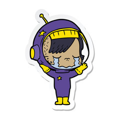 sticker of a cartoon crying astronaut girl
