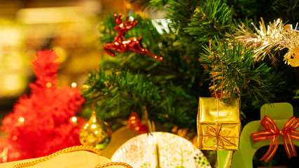 Deer and ornaments hanging on the Christmas tree
