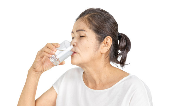 Old Asian Woman Drinking Plain Of Water For Health