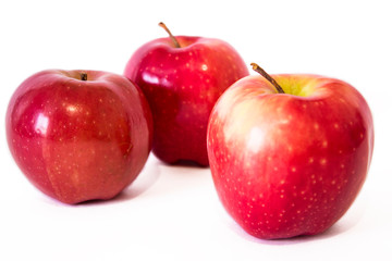 Ripe red apples isolated on white background