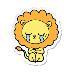 sticker of a crying cartoon lion