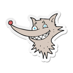 sticker of a cartoon grinning wolf face