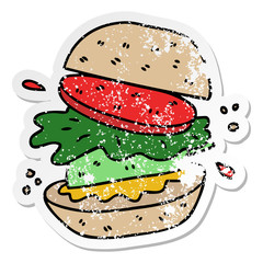 distressed sticker of a quirky hand drawn cartoon veggie burger