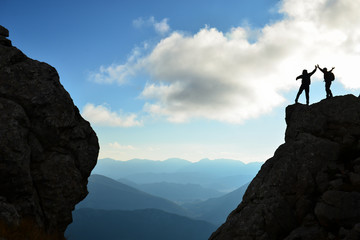 the happiness of success in the hills, cliffs and dangerous places