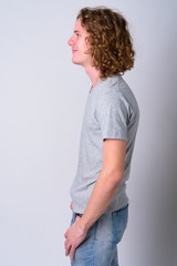 Profile view of young handsome man with curly hair