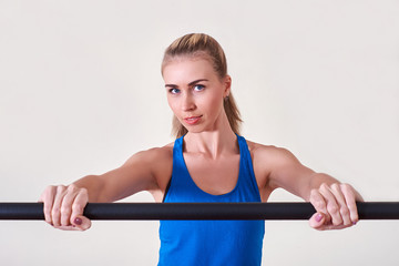 Female athlete doing sport exercise. Concept of health and body care.