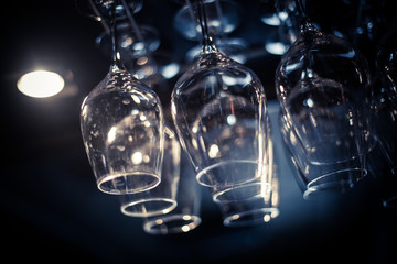 Hanging wine glasses in a pub