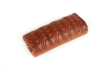 Chocolate biscuit roll cake isolated on white background.