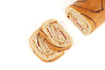 Biscuit roll cut into pieces, on a white background.