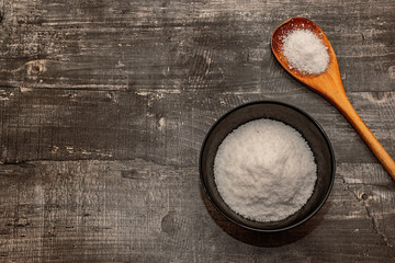 Cooking base kitchen concept. Salt on wooden desk surface. Flat layout top view