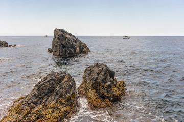 Fototapeta na wymiar Italy, Cinque Terre, Manarola, a rocky beach next to a body of water