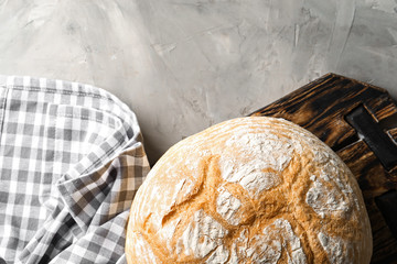 Tasty bread on grey background