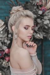 delicate portrait of attractive blonde woman with bare shoulders