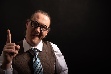 Funny nerd or geek pointing with finger smart science