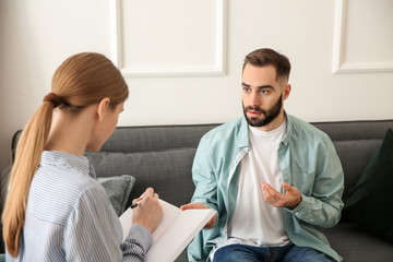 Female psychologist working with patient in office