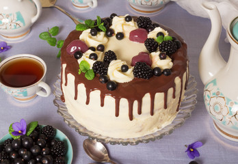 Candy bar. Cake with berries and warm herbal tea