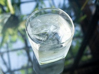 A glass of cold drinking water with ice