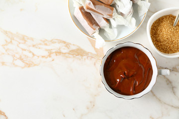 Composition with tasty caramel on table