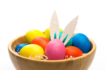 easter eggs with bunny ears in bowl isolated