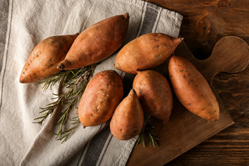 Raw sweet potato on table