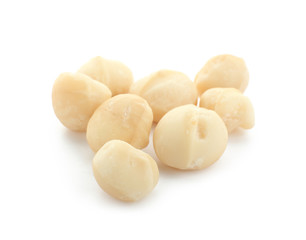 Fototapeta na wymiar Peeled macadamia nuts on white background