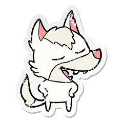 distressed sticker of a cartoon wolf laughing