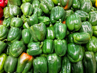 Obraz na płótnie Canvas Bell pepper. Heap of fresh green sweet peppers for sale on farming market. Vegetables background