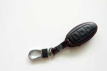 Remote control of car on white background