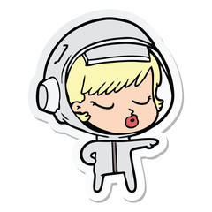 sticker of a cartoon pretty astronaut girl pointing the way
