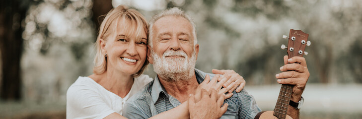 Lifestyle senior couple happy and relaxed . Good Healthy elderly in park nature. Group of Senior Retirement dancing, relaxtion, enjoy vacation summer 
