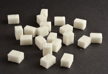 Sugar cubes on black background
