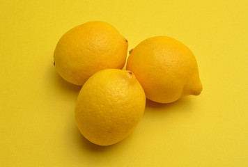 Lemons on yellow background