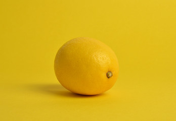 Lemon on yellow background