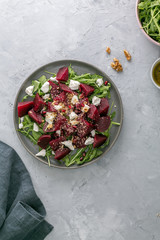 Beetroot salad with feta cheese, argula and walnuts