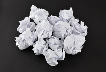 Crumpled papers on black
