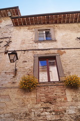 Facade of a typical palace in the center of Gubbio, Umbria, Italy