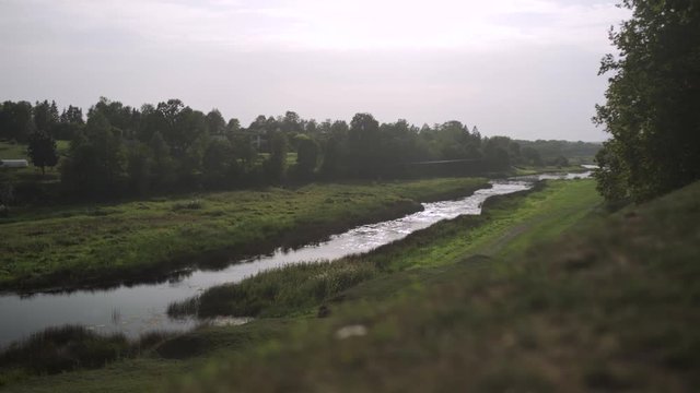 Slider shot of running river Musa in Bauska, Latvia