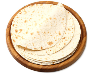 Tortilla wrap on wooden board isolated on white background