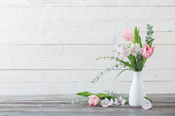 spring flowers in white vase