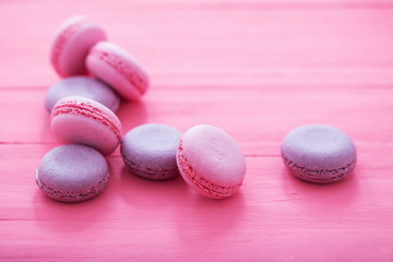 pink macaroons on wooden background