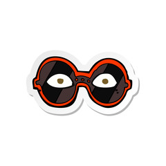 sticker of a cartoon eyes in dark glasses
