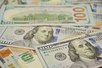  100 Dollars bill and portrait Benjamin Franklin on USA money banknote. Earning money and saveing money concept photo.