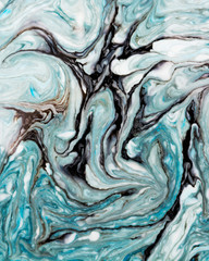 Abstract beautiful marbling with white and blue colors.The Eastern style of Ebru painting on water with acrylic paints swirls marbling.A stylish mix of natural luxury 