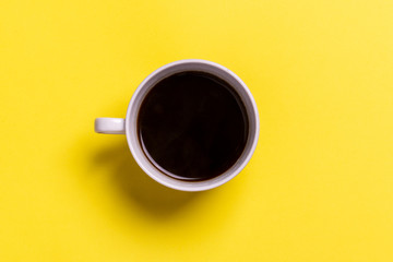 cup of coffee on a yellow background
