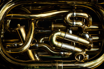 Detail of the brass pipes of a tuba © Rixie