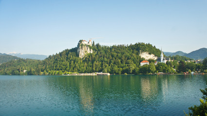 Fototapeta na wymiar Beautiful view over Lake Bled, Julian Alps and Bled castle, sunny day, Bled, Slovenia